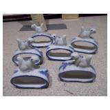 The image displays a collection of Delft blue and white ceramic items