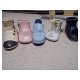 These items are vintage ceramic baby shoe planters