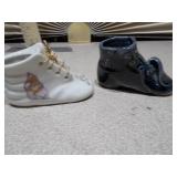 These items are vintage ceramic baby shoe planters