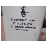 These items are vintage ceramic baby shoe planters