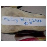 These items are vintage ceramic baby shoe planters