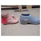 These items are vintage ceramic baby shoe planters