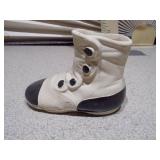 These items are vintage ceramic baby shoe planters