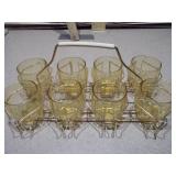 This is a set of eight Libbey Tempo Amber Flat Tumblers in a metal caddy.