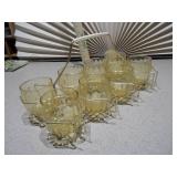 This is a set of eight Libbey Tempo Amber Flat Tumblers in a metal caddy.