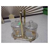 This is a vintage mid-century modern Jeannette Glass Co. condiment set with a gold-tone caddy.