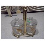 This is a vintage mid-century modern Jeannette Glass Co. condiment set with a gold-tone caddy.
