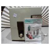 This is a vintage Oster Automatic Juice Extractor (model 323-08B