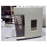 This is a vintage Oster Automatic Juice Extractor (model 323-08B