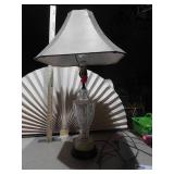 This is a cut glass table lamp with a fabric shade.
