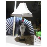 This is a cut glass table lamp with a fabric shade.