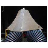 This is a cut glass table lamp with a fabric shade.