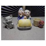 The image displays several collectible figurines