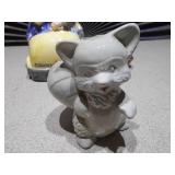 The image displays several collectible figurines