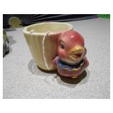 The image displays several collectible figurines