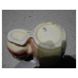 The image displays several collectible figurines