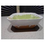 The image features several ceramic planters,