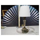 This is a vintage crystal and brass table lamp