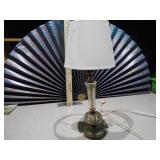 This is a vintage crystal and brass table lamp