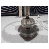 This is a vintage crystal and brass table lamp