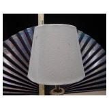 This is a vintage crystal and brass table lamp