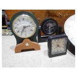 The image displays several clocks,