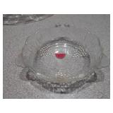 The image features a collection of vintage pressed glass bowls