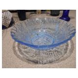 The image displays a collection of various cobalt blue glass items,