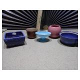 These are a collection of miniature ceramic vases and planters, likely vintage Shawnee pottery items.