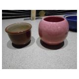 These are a collection of miniature ceramic vases and planters, likely vintage Shawnee pottery items.