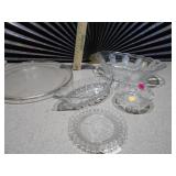 This is a collection of vintage or antique clear glass dishes