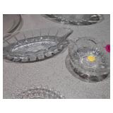 This is a collection of vintage or antique clear glass dishes
