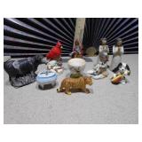 The image displays a collection of various ceramic figurines