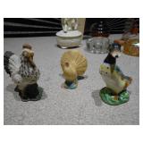 This is a collection of assorted vintage porcelain and ceramic figurines and home decor items.