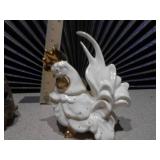 ceramic turtle votive candle holder and a white and gold ceramic rooster figurine.