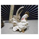 ceramic turtle votive candle holder and a white and gold ceramic rooster figurine.