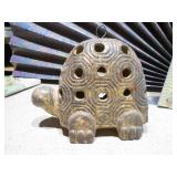 ceramic turtle votive candle holder and a white and gold ceramic rooster figurine.