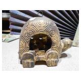 ceramic turtle votive candle holder and a white and gold ceramic rooster figurine.