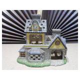 This is a PartyLite Olde World Village Candle Shoppe Tealight House