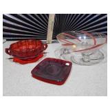 The image displays a collection of ruby red glass collectible items,