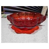 The image displays a collection of ruby red glass collectible items,