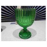 The image displays a collection of vintage pressed glass goblets and a compote dish.