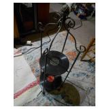 This is a vintage wrought iron two-tier stand