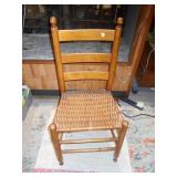 This is a Shaker-style ladder back side chair with a woven rush seat
