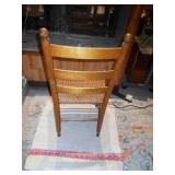 This is a Shaker-style ladder back side chair with a woven rush seat