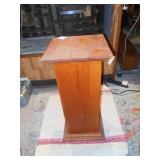This is a wood pedestal or plant stand