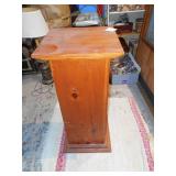 This is a wood pedestal or plant stand