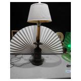 This is an antique wooden wagon wheel hub table lamp