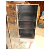 This is a vintage industrial steel mobile display cabinet