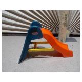 This image features a collection of various vintage and small toy figures